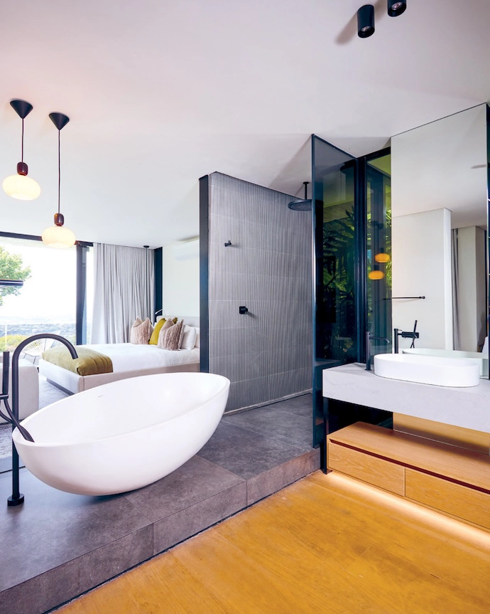 Open-plan living needn’t come at the expense of privacy, as this en suite bathroom design illustrates.