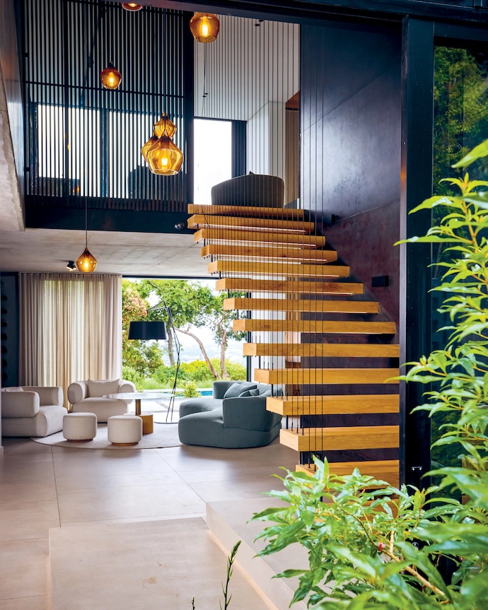 The interior design was a collaborative effort by Del Fante Design Studio and Hendre Bloem, whose bespoke couches welcome visitors at the entrance.