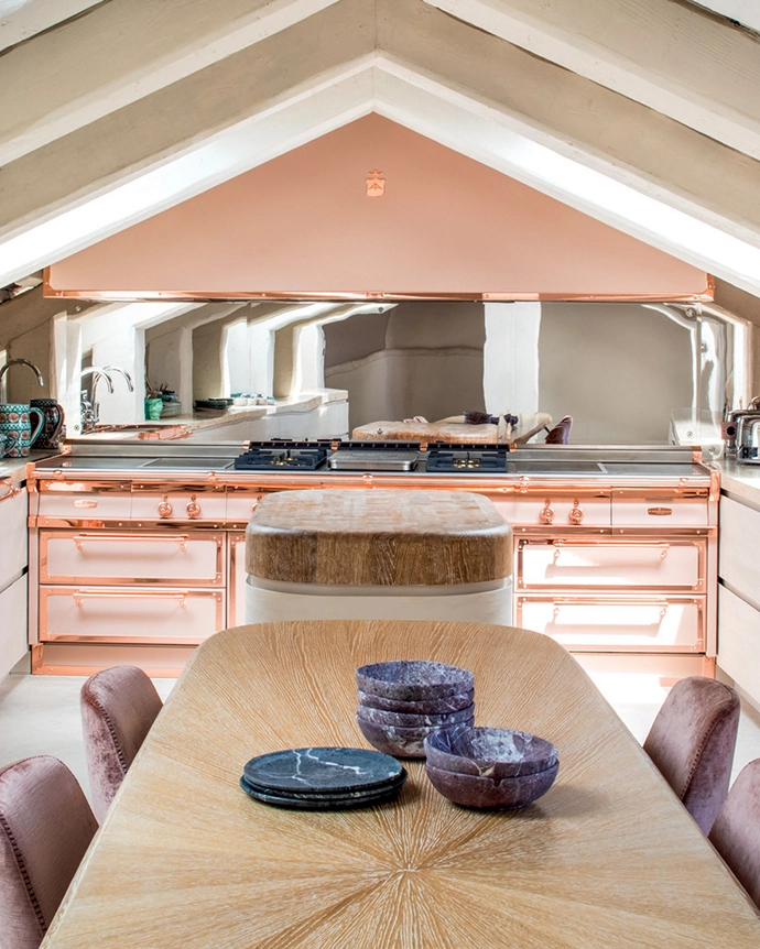 This luxurious kitchen by Oﬃ cine Gullo, installed in a historical Venetian residence, masterfully blends a custom “Cream Tan” shade (Pantone 13-1108) with polished copper accents for a soft yet opulent aesthetic.