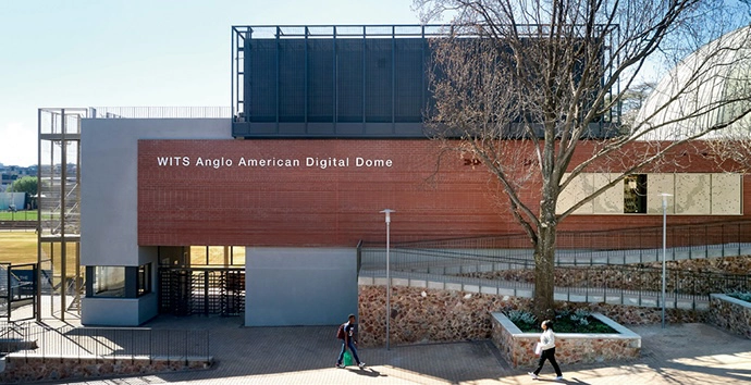 The entrance to the stadium is visible at the bottom left of the new wing. 