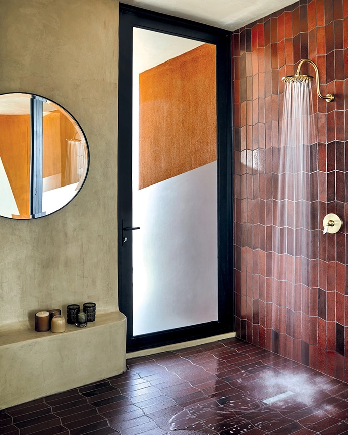 Africote’s clay-coloured Natural Cement paint celebrates and amplifies the Ekipa design that’s echoed in the bespoke railings.