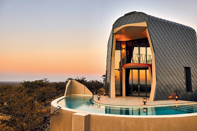 Captured as the sun rises above Etosha, Ekipa’s curved swimming pool offers a luxurious respite after a day spent viewing the abundant game in the famous Namibian national park.
