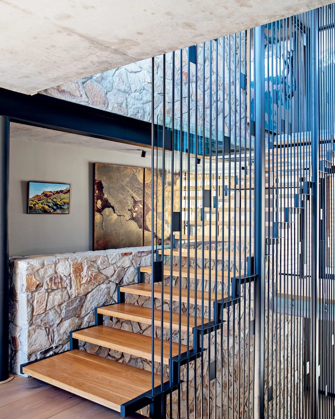 The floating staircase acts as an orientation device, creating connection and cohesion between the home’s various levels.