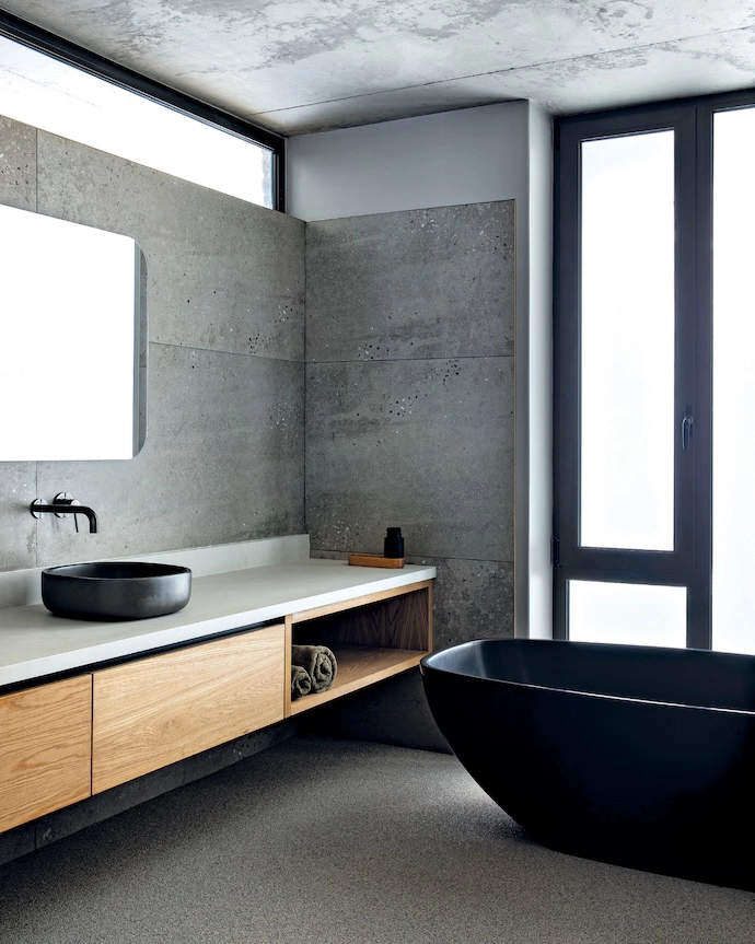 With a pared-back palette and ample natural light, the guest bathroom exudes Zen-like serenity.