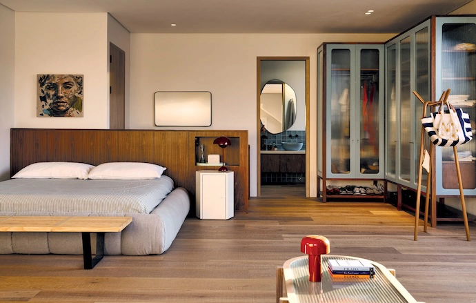 Another bedroom features cupboards by Versfeld and a custom bed.