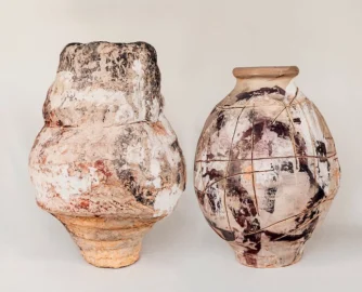 Two multicoloured glazed sculptures from his new collection: Crust Rock (left) and Fissure Stone.