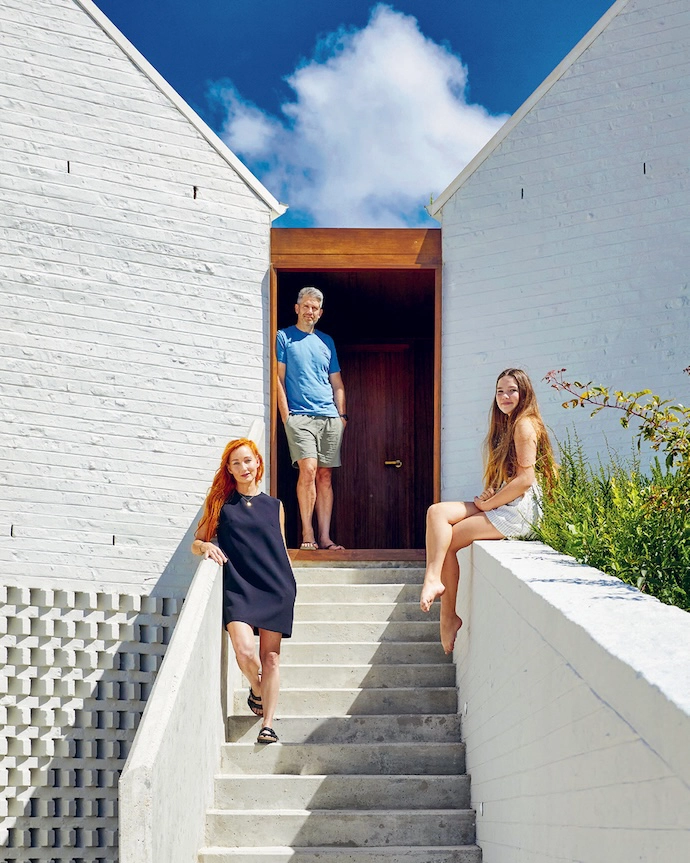 Owners Nina, Alastair and Chloe Stewart on the front steps.