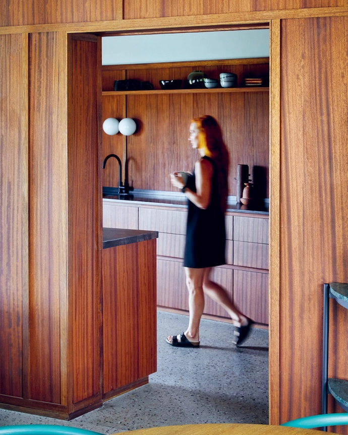 Situated behind the wood-panelled wall that separates it from the living and dining area, the kitchen is by Plett-based company Wooden Wonders.