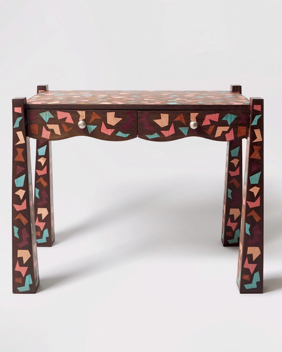 The Kapla Disco desk features flared legs, wavy drawers and handcrafted marquetry.