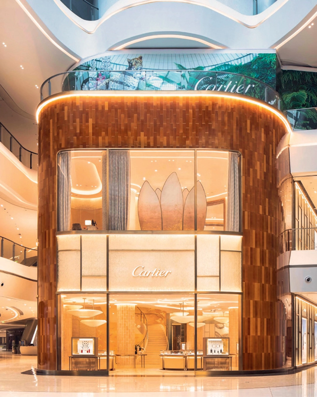 The exterior of the Cartier boutique in Haikou, China, alternates undulating glass with glossy ceramic tiles.