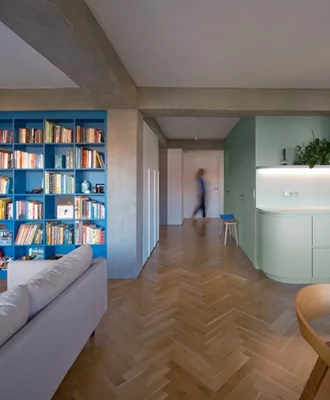 A green core defines the rhythm of the space, while blue and pink accents bring vibrancy and balance.