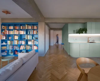 A green core defines the rhythm of the space, while blue and pink accents bring vibrancy and balance.