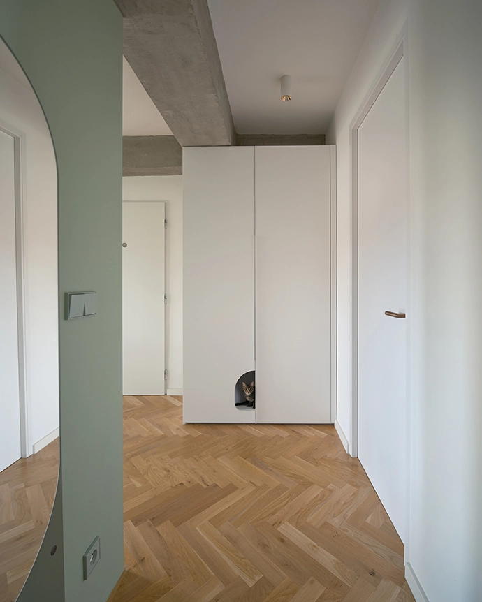 Every corner of this Prague apartment tells a story through details – from the copper skin to the hidden cat passage.