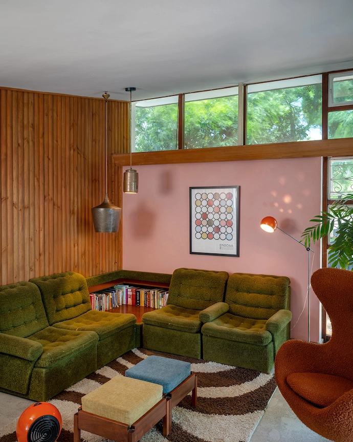 Starring a vintage GEC ball heater, an Arne Jacobsen Egg chair, and an orange Eyeball lamp by Robert Sonneman, the lounge shows off cinematographer Johannes’s set-design chops.