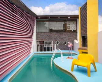 With a replica Garden Party chair by Luigi Colani for Heinz Essmann in the mix, the kidney-shaped pool and surrounding entertainment area recently received a 1970s Miami makeover.