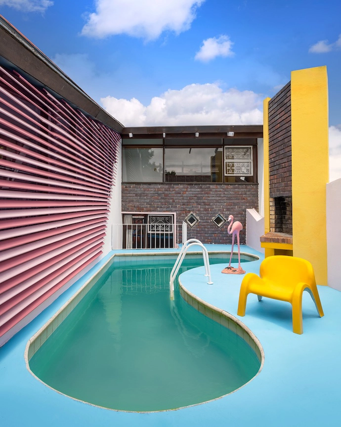 With a replica Garden Party chair by Luigi Colani for Heinz Essmann in the mix, the kidney-shaped pool and surrounding entertainment area recently received a 1970s Miami makeover.