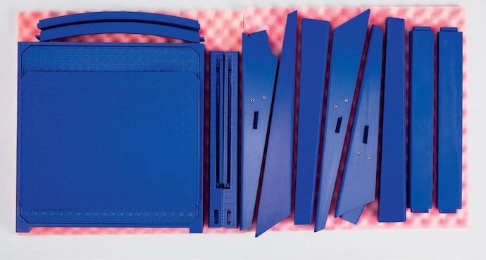 The unassembled components of the Flat Pack Jeanneret chair.