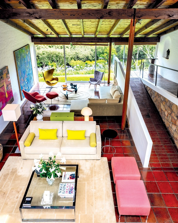 Walk through the front door and the house opens up into a double-volume living area with a view out towards Kirstenbosch and the mountain above it.