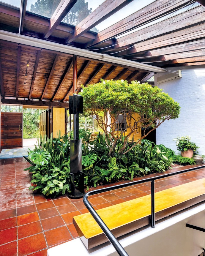 The entrance hall with an indoor garden fed by natural light from the skylights above that architect Gawie Fagan designed for his mother – an avid gardener.