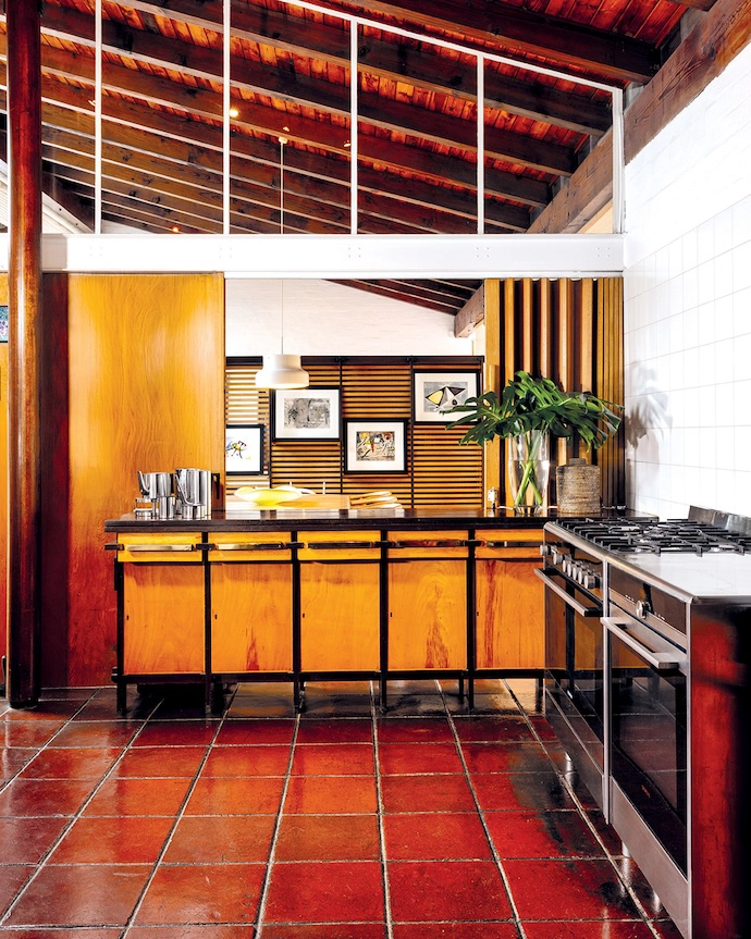 The kitchen still has all the original cabinetry, made of dark imbuia and light Japanese birch and beech. The brass handles are also original.