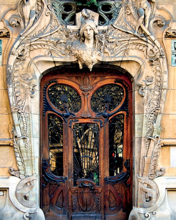 The ornate door of an Art Nouveau building in Paris by Jules Lavirotte, with sculptures by Jean-François Larrieu.