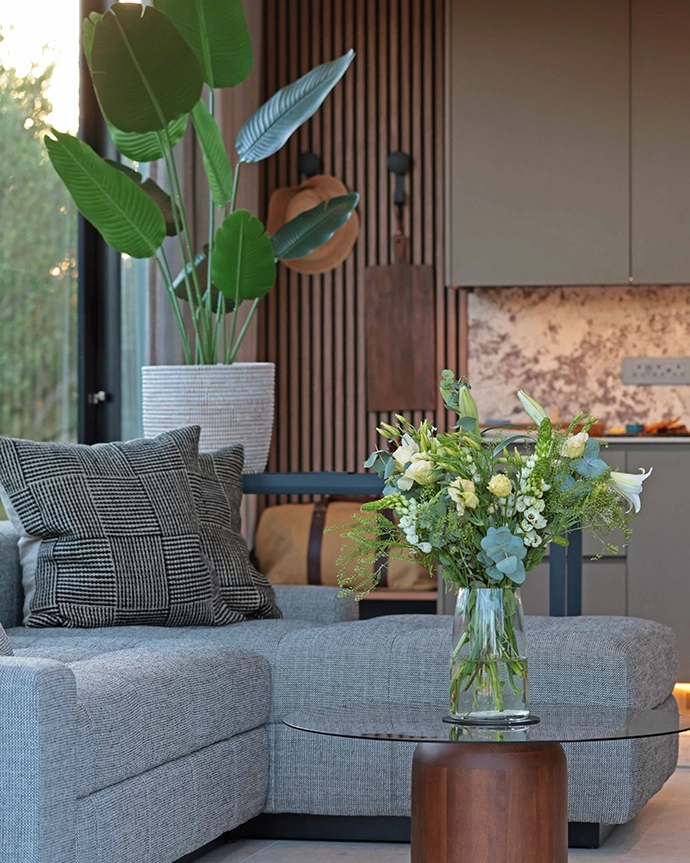 The layered interiors feature a neutral palette and natural textures.