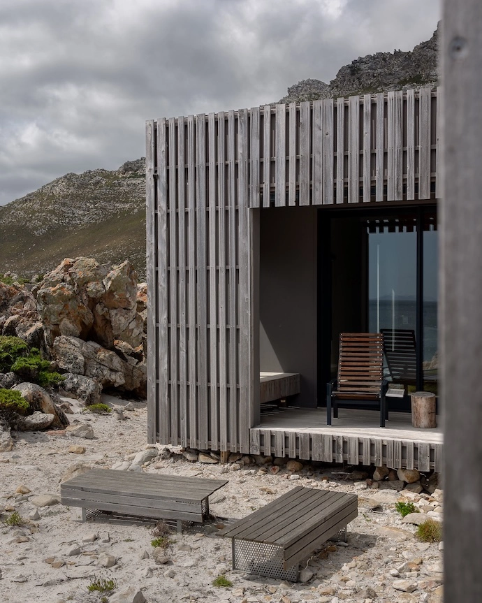 One of the bedrooms has its own veranda and private sea view; a built-in bench seat - another of the owner’s designs - offers storage and a reading nook.