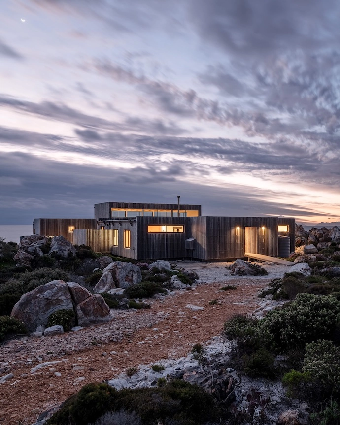 Situated on the water’s edge, this contemporary sea cabin is so remote that its owner had to build an access road with stones quarried from the surrounds.