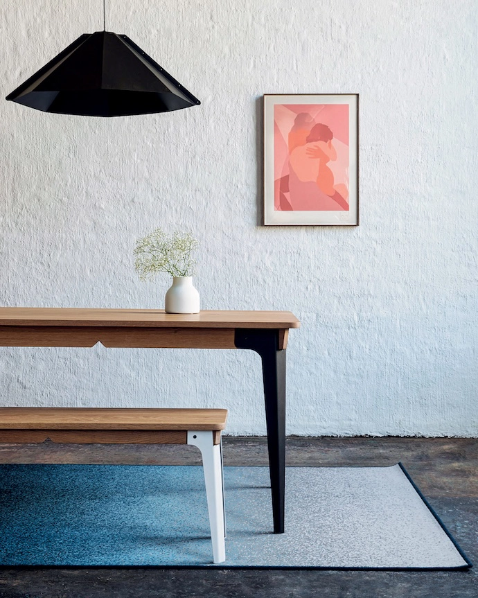 Foldi dining table and bench in natural wood.