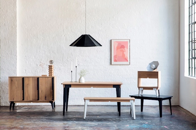 Tandem’s Foldi range includes a cabinet, a dining table and bench, a bedside table, a coﬀ ee table, and a pendant lamp.