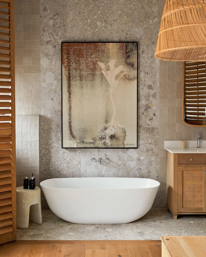 “We layered raw stone, handcraft ed tiles and natural wood to create a tactile experience that’s both organic and refined,” says Kelsey Boyce of Durban-based Fyfe Boyce Interior Design about this bathroom. “The artwork adds softness, balancing the materiality with a sense of warmth and depth.” For a handcraft ed look, consider tiles from Wolkberg Casting Studio.