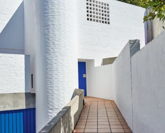 Designed by Adèle Naudé Santos and Antonio de Souza Santos, the home’s blank street- facing facade provides privacy from passers-by.
