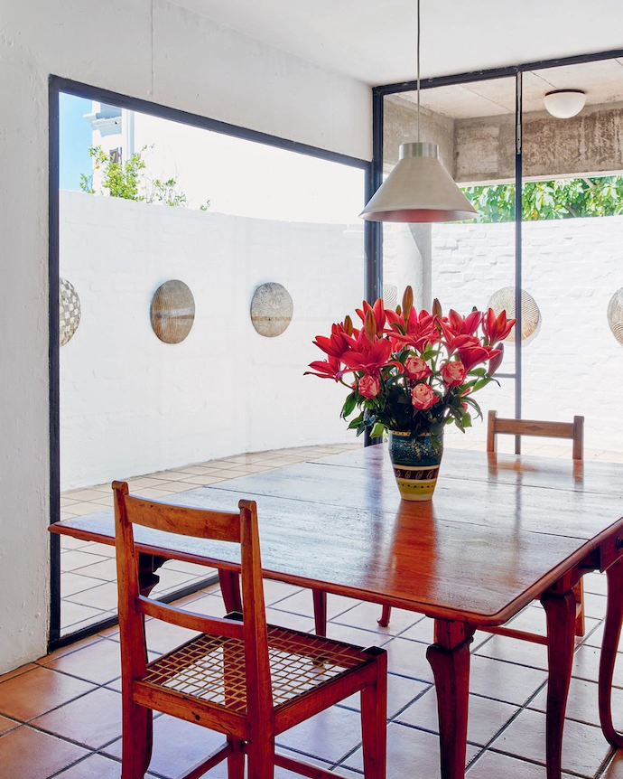 African shields adorn the walls of the sunny courtyard.