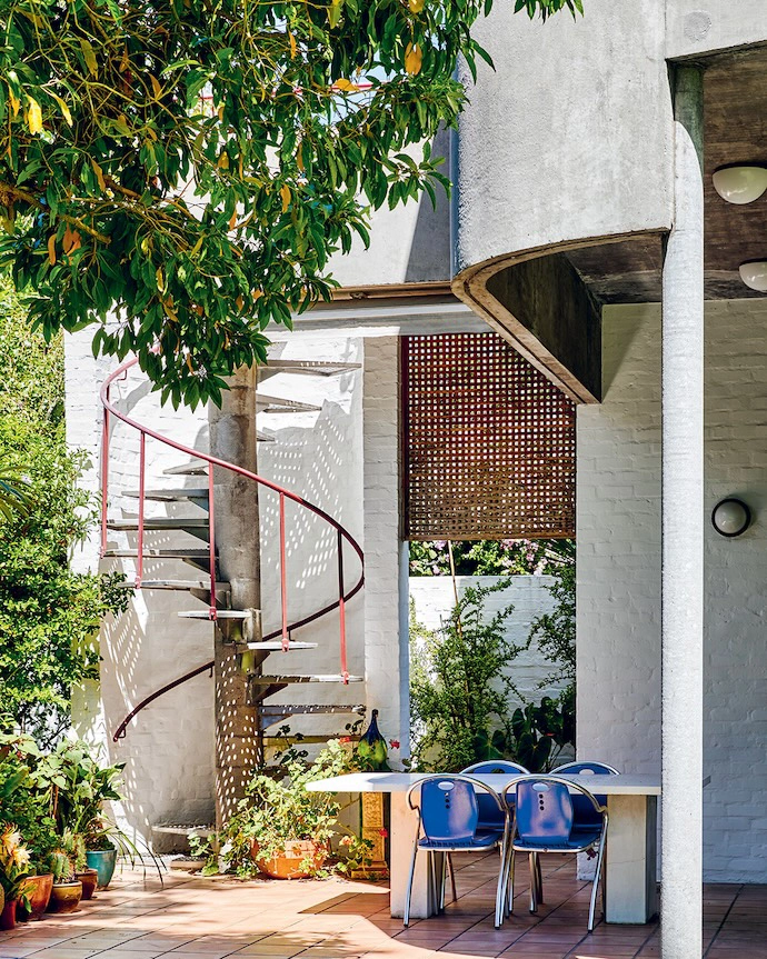 The area next to the spiral metal staircase is a favourite for outdoor entertaining.
