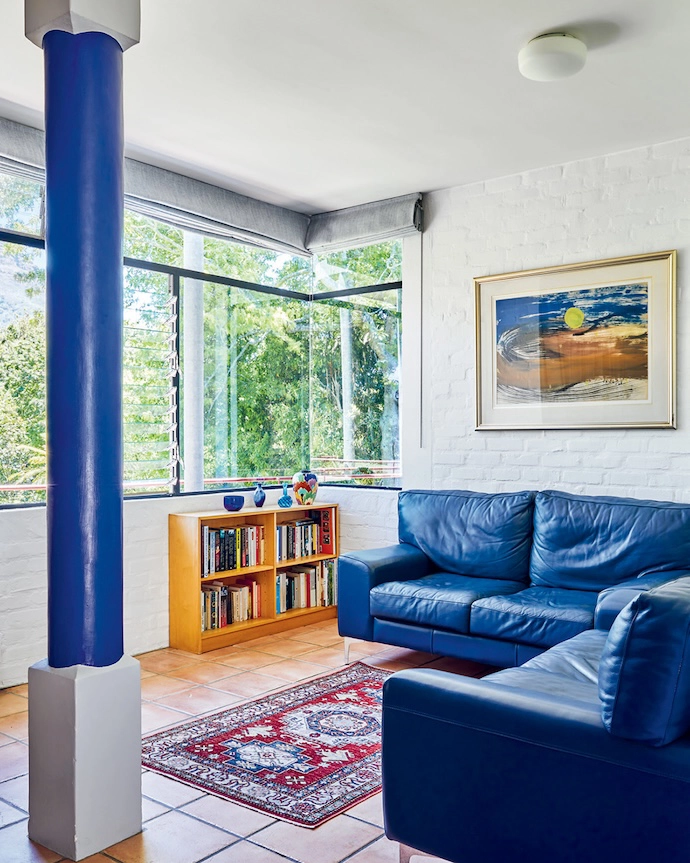 Pops of red and royal blue abound, including a Pedersen + Lennard chest of drawers and an accent pillar.