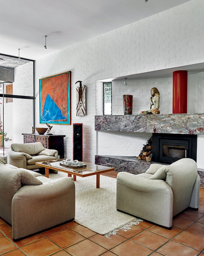 All the artworks in the lounge are by women, including a painting by Jill Trappler, a Burkinabé carved wooden shield, and a sculpture by Evette Weyers.