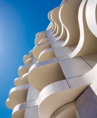 The Cole hotel’s asymmetrical balconies that overhang the property’s boundaries (with the required permission, of course). They’re described as “Baroque operatic” by the architect, Robert Silke.