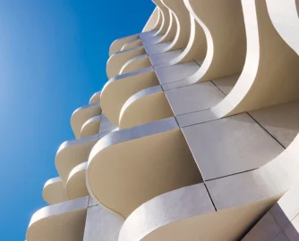 The Cole hotel’s asymmetrical balconies that overhang the property’s boundaries (with the required permission, of course). They’re described as “Baroque operatic” by the architect, Robert Silke.