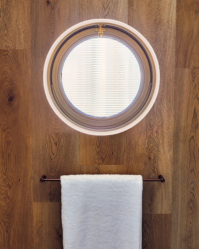 Porthole window detail in the bathroom.
