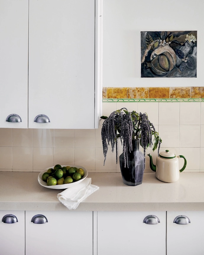 Kitchen cabinetry with period-correct handles.