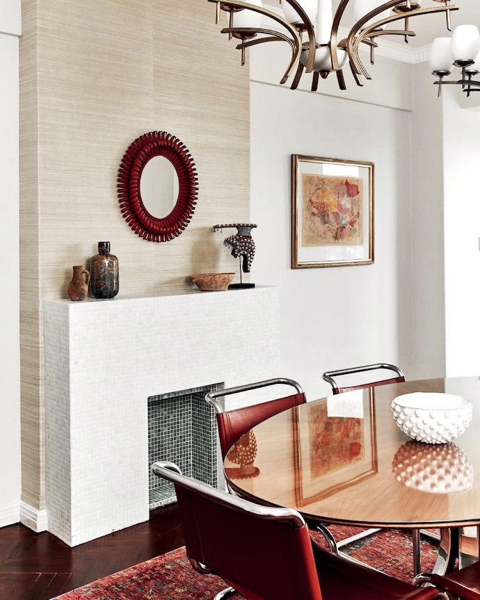 On the mantelpiece, a Neil Bradford ceramic vase is flanked by a Moroccan terracotta vase and bowl.