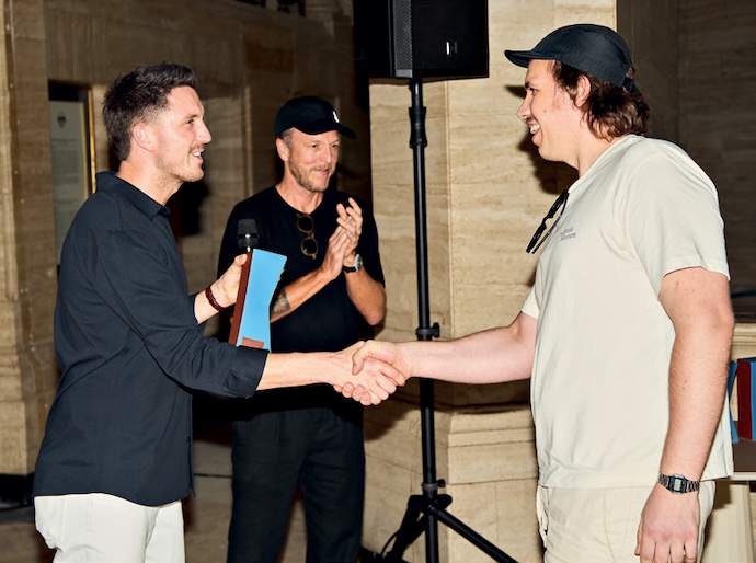 Design Prize judge Roddy Clarke hands over the Design category prize to Martin Tallie of DEFT Studios.