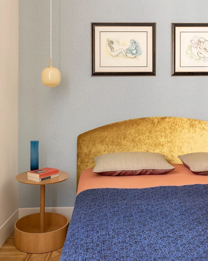 The master bedroom with Elsworthy Wide Width wallpaper by Harlequin Fabrics, and VL45 Radiohus Pendant lamp by Louis Poulsen.