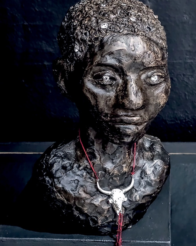 Dr Khanya Mthethwa's The Sacrifi ce (2025) in cold cast bronze, sterling silver, cubics and beads.