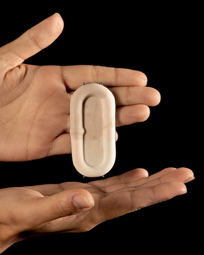 Brooch from the {Un}connected series (2023), in porcelain and naturally harvested clay, by Joani Groenewald
