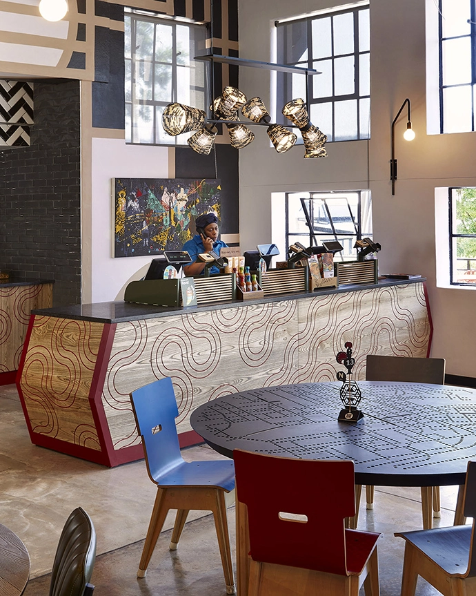 Beaded light by Thabisa Mjo of Mash. T Design above serving counter by Dokter and Misses at Nando’s Central Kitchen, featuring furniture, art and lighting by numerous South African designers. Curated by Tracy Lynch, creative director Clout/SA