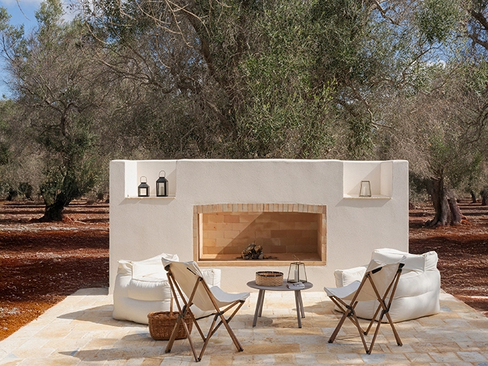 In the back garden at the end of a small pathway from the house is a secluded barbecue and fireplace.