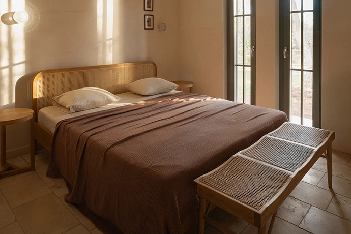 The second en-suite bedroom features a loamy palette.
