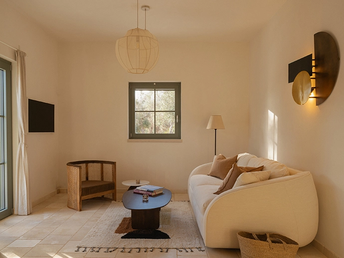 The lounge features soft neutral furnishings from Bolia and ZARA HOME.