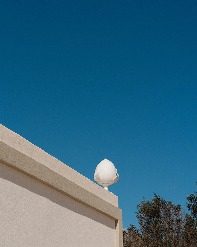 The Pina figures on top of the second villa's roof is a traditional symbol of the region.